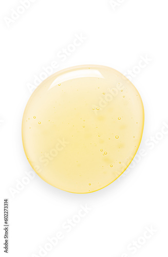 Yellow drops of gel close up. Cosmetic product for moisturizing the skin of the face or body. Isolated on a white background.