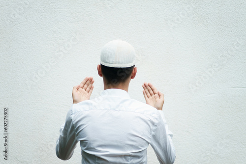portrait of a Muslim believer isolated on a white background