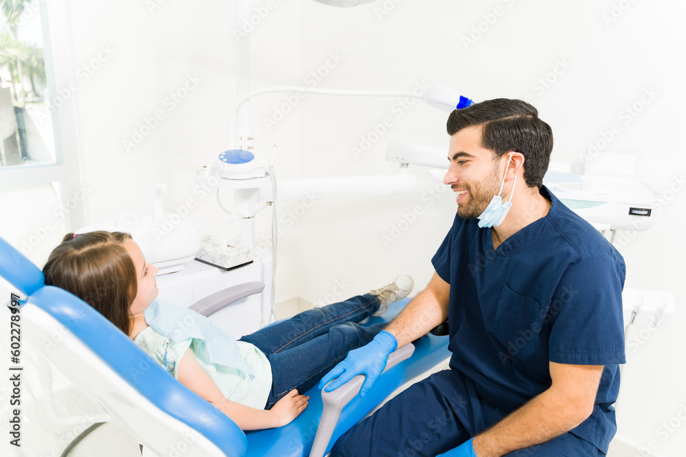Happy pediatric dentist with a child patient Happy pediatric dentist with a child patient