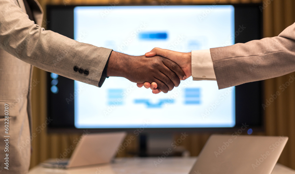 Image two business partner meeting successful handshake together with success join congratulation good deal contract in modern office.Partnership approval and teamwork concept Image two business partner meeting successful handshake together with success join congratulation good deal contract in modern office.Partnership approval and teamwork concept