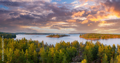 Sunrise in the wild. Dawn. Nature of Karelia. Pine on the shore of Lake Ladoga. Travel to Russia. Republic of Karelia. Islands. Northern nature. The sun above the water. photographed from heights