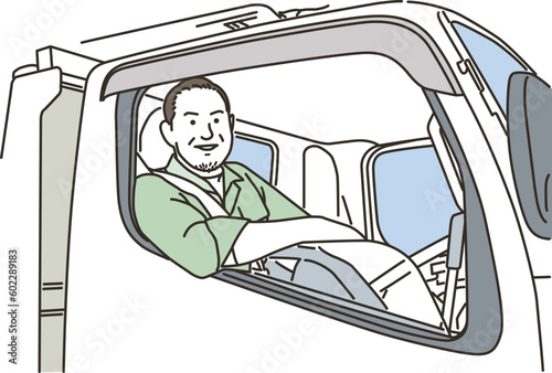 トラックを運転する笑顔の男性作業員
