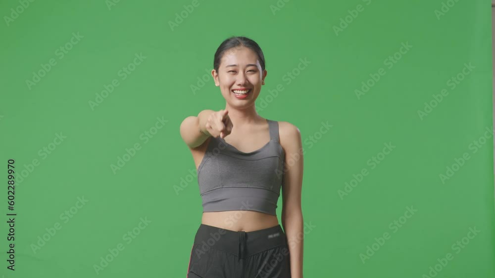 Asian Woman Wearing Sportswear And Touching Her Chest Then Smiling And Pointing To Camera Being Proud Of Herself On Green Screen Background In The Studio
Asian Woman Wearing Sportswear And Touching Her Chest Then Smiling And Pointing To Camera Being Proud Of Herself On Green Screen Background In The Studio