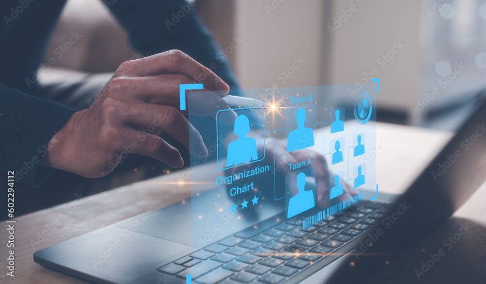 Fototapeta premium teamwork concept, team management, manager businessman using computer laptop pointing at organisation chart, HR management, team recruiting