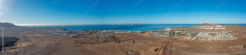 Drone panorama over Playa Blanca vacation village in Lanzarote