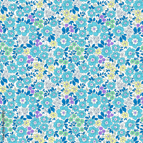 Beautiful floral pattern in small abstract flowers. Small blue flowers. White background. Ditsy print. Floral seamless background. Liberty template for fashion prints. Stock pattern.