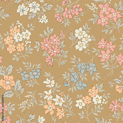 Cute floral pattern in small flowers. Small colorful flowers. Gold beige background. Delicate ditsy print. Floral seamless background. Elegant template for fashion prints. Stock pattern.