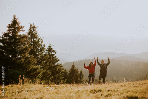 Smiling couple walking with...