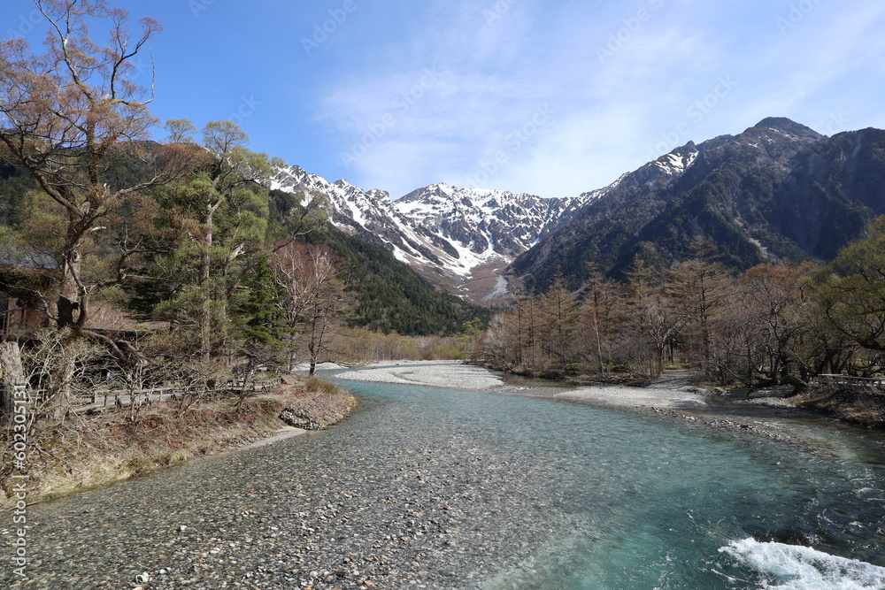 The clear Azusa River and snow-capped Mount Hotaka viewed from Kappa-bashi in Kamikochi, Japan