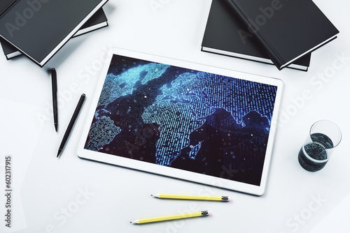 Abstract creative world map on modern digital tablet screen, international trading concept. Top view. 3D Rendering