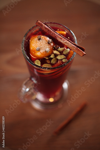 Fruit tea or mulled wine with berries in a glass cup