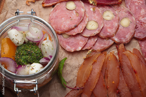 A large collection of appetizers from a variety of meats and sauces photo