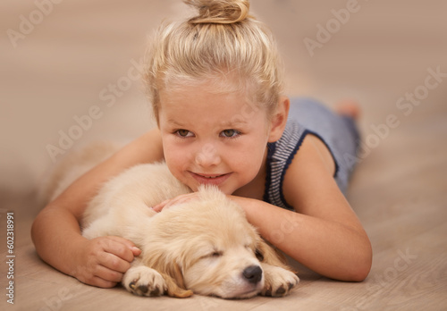 Photography Girl kid hug her puppy, relax at home and happy with sleeping golden retriever dog and child with smile