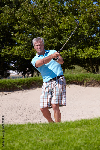 Sports, portrait and old man with golf club swing outdoor for fitness, training and practice. Face, golfing and senior male golfer swinging driver in a park, serious and enjoying retirement hobby