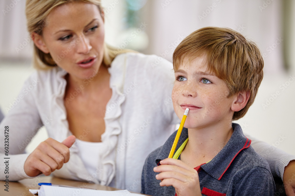 School, woman helping student with homework or question and in classroom. Education or learning, female teacher assisting male child and boy with pencil at mouth for thinking or find solution. School, woman helping student with homework or question and in classroom. Education or learning, female teacher assisting male child and boy with pencil at mouth for thinking or find solution.