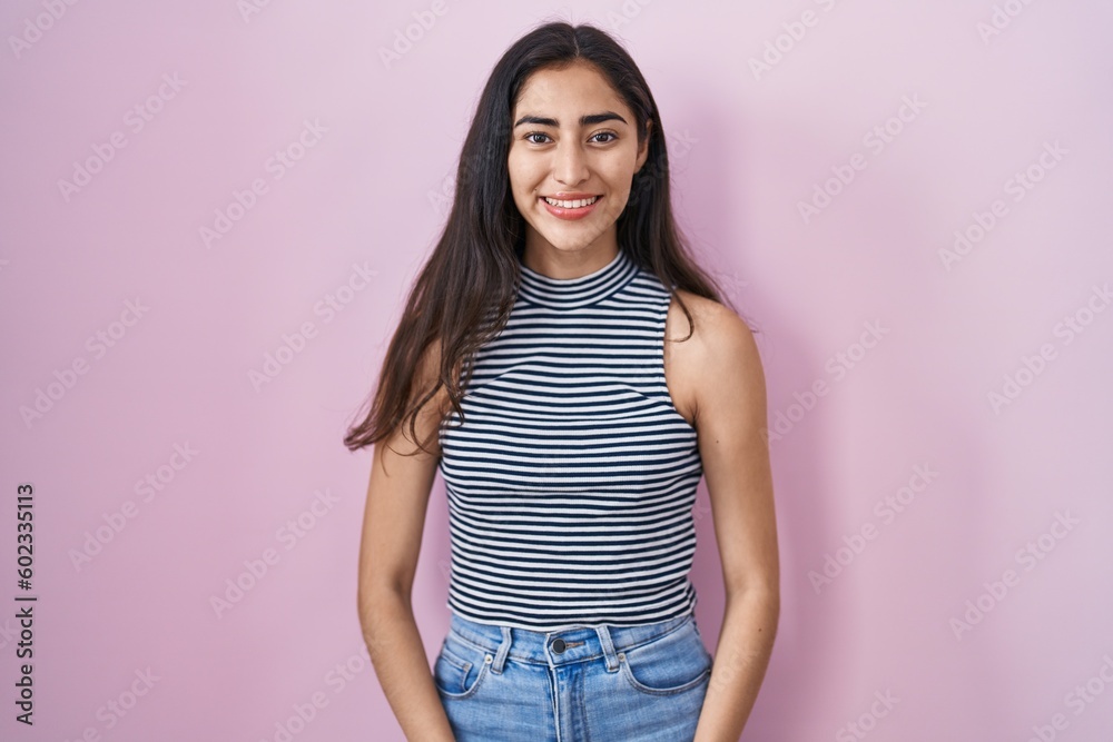 Young teenager girl wearing casual striped t shirt with a happy and cool smile on face. lucky person. Young teenager girl wearing casual striped t shirt with a happy and cool smile on face. lucky person.