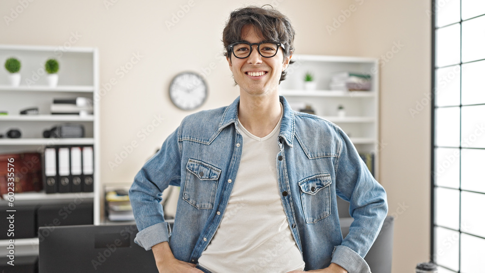 Fototapeta premium Young hispanic man business worker smiling confident at office