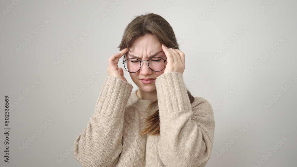 Young blonde woman stressed standing over isolated white background Young blonde woman stressed standing over isolated white background