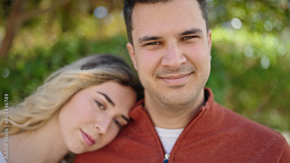 Man and woman couple smiling confident standing together at park Man and woman couple smiling confident standing together at park