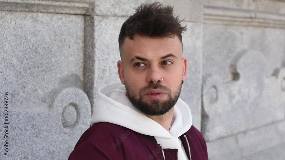 Boy looking at the camera with a surprised expression