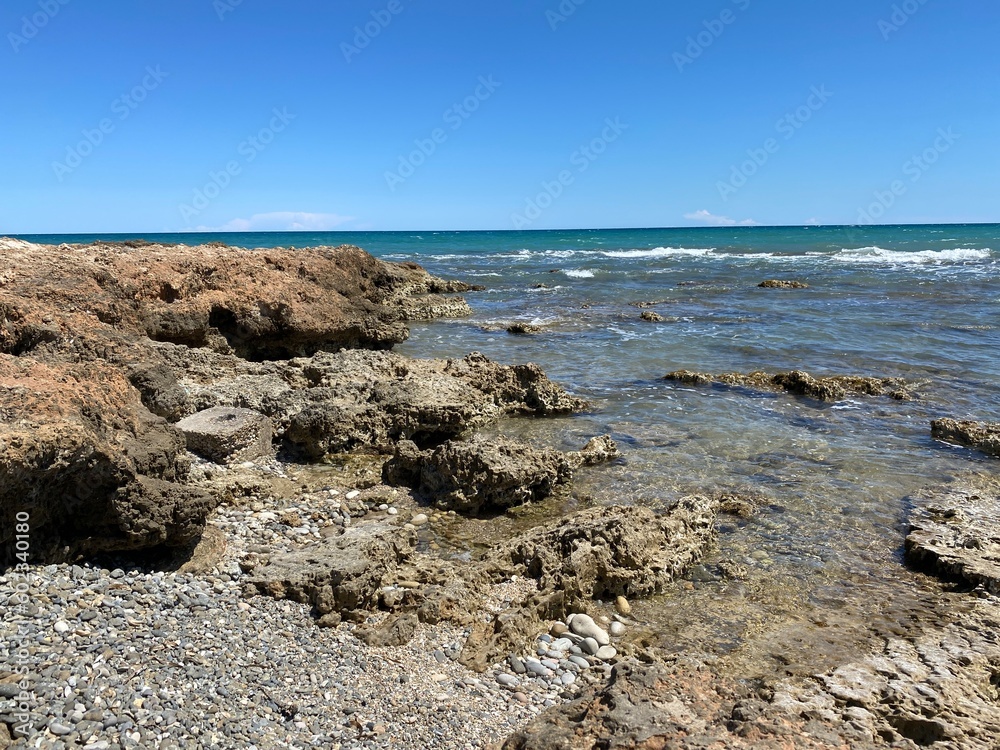 Beautiful rocky beach on a clear sunny day, Spain Beautiful rocky beach on a clear sunny day, Spain