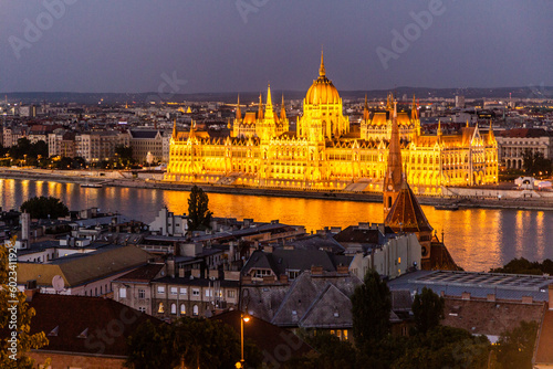 Evening view of Danube river and Hungarian Parliament Building in Budapest, Hungary © Matyas Rehak