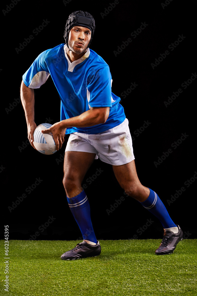 Rugby, dark and man sports athlete pass a ball at night in black studio background training, wellness and fitness. Exercise, workout and professional career of sport male person or player on grass Rugby, dark and man sports athlete pass a ball at night in black studio background training, wellness and fitness. Exercise, workout and professional career of sport male person or player on grass