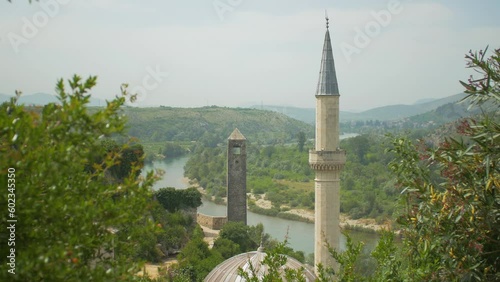 Old church and monument in the middle of nature by the river in the village of Počitelj, Bosnia