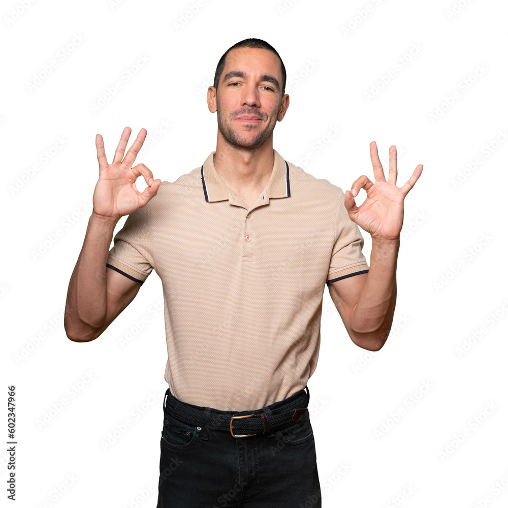 Surprised young man with a gesture of approval Surprised young man with a gesture of approval
