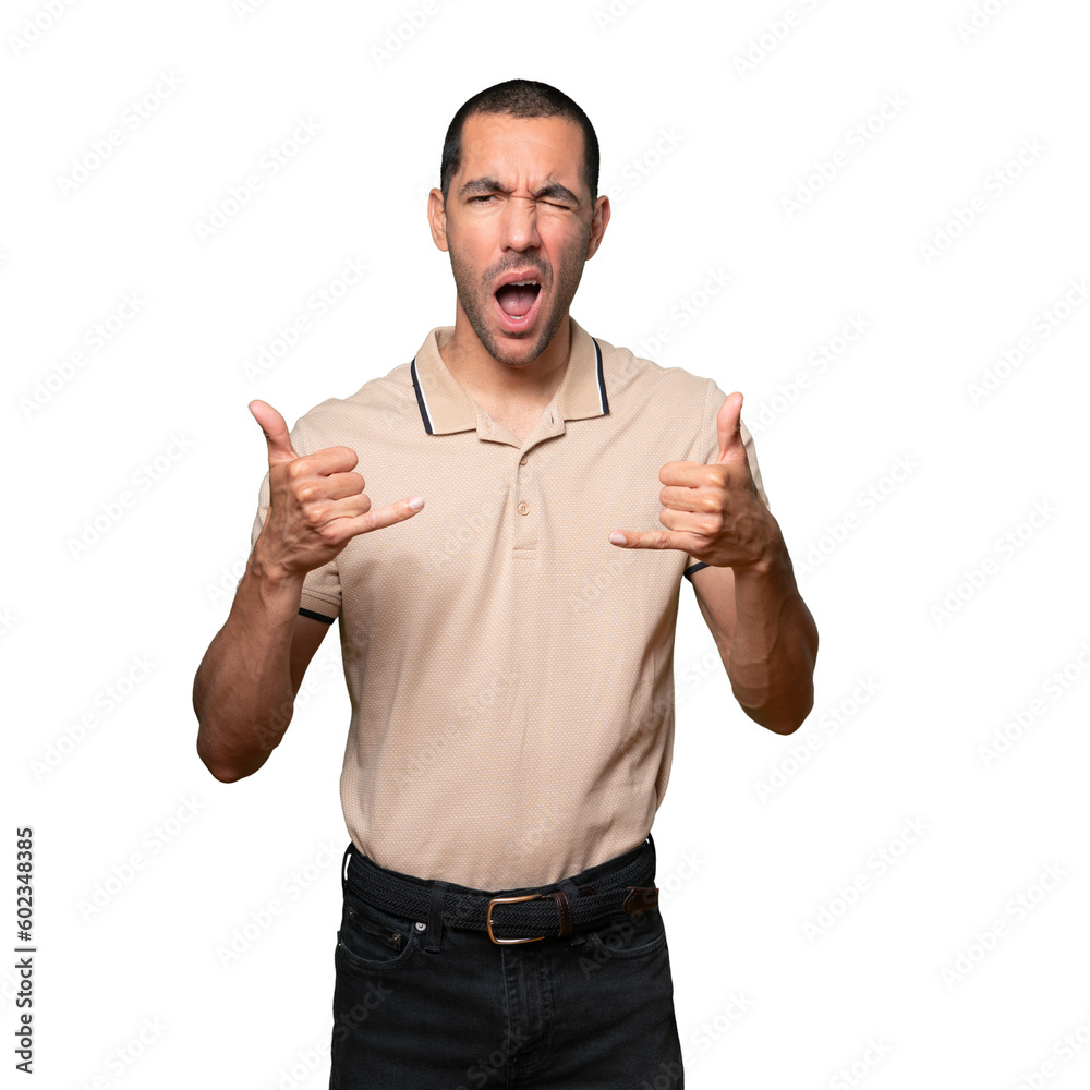 Fototapeta premium Amazed young man making a gesture of calling with the hand