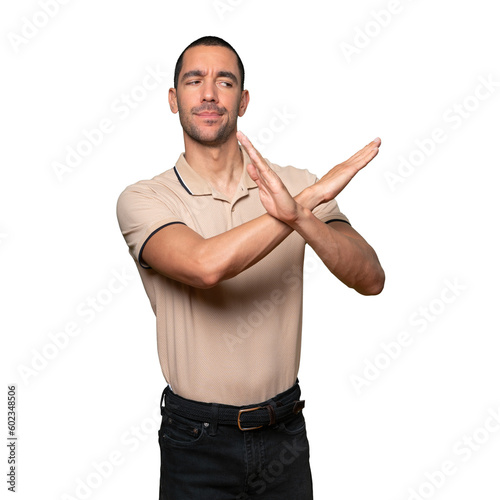 Young man making a gesture of not crossing with the arms photo