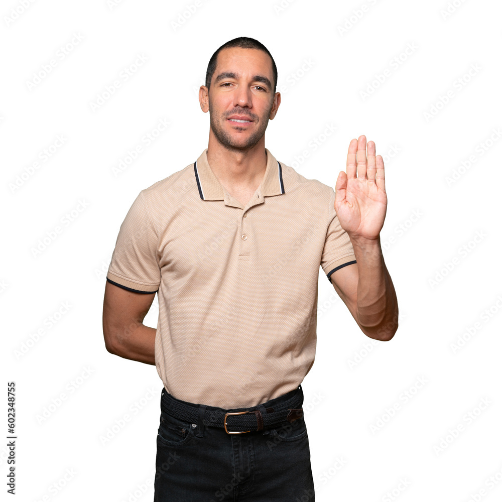 Happy young man making a gesture of stop with his palm Happy young man making a gesture of stop with his palm