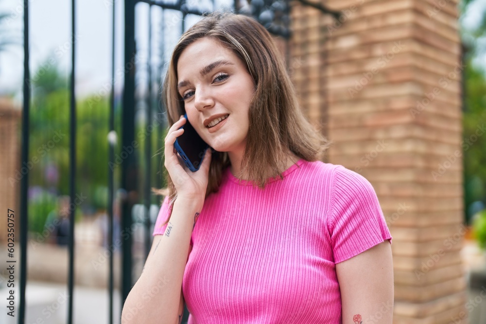 Young woman smiling confident talking on the smartphone at street Young woman smiling confident talking on the smartphone at street
