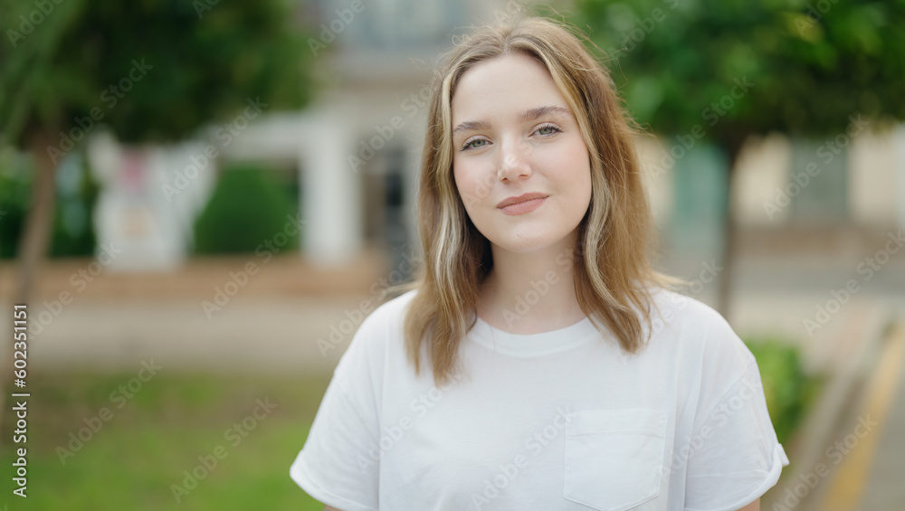 Young caucasian woman smiling confident standing at park