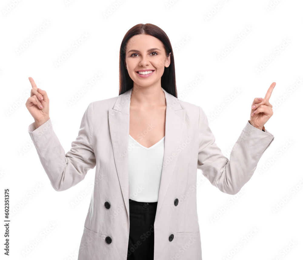 Beautiful businesswoman in suit pointing at something on white background Beautiful businesswoman in suit pointing at something on white background