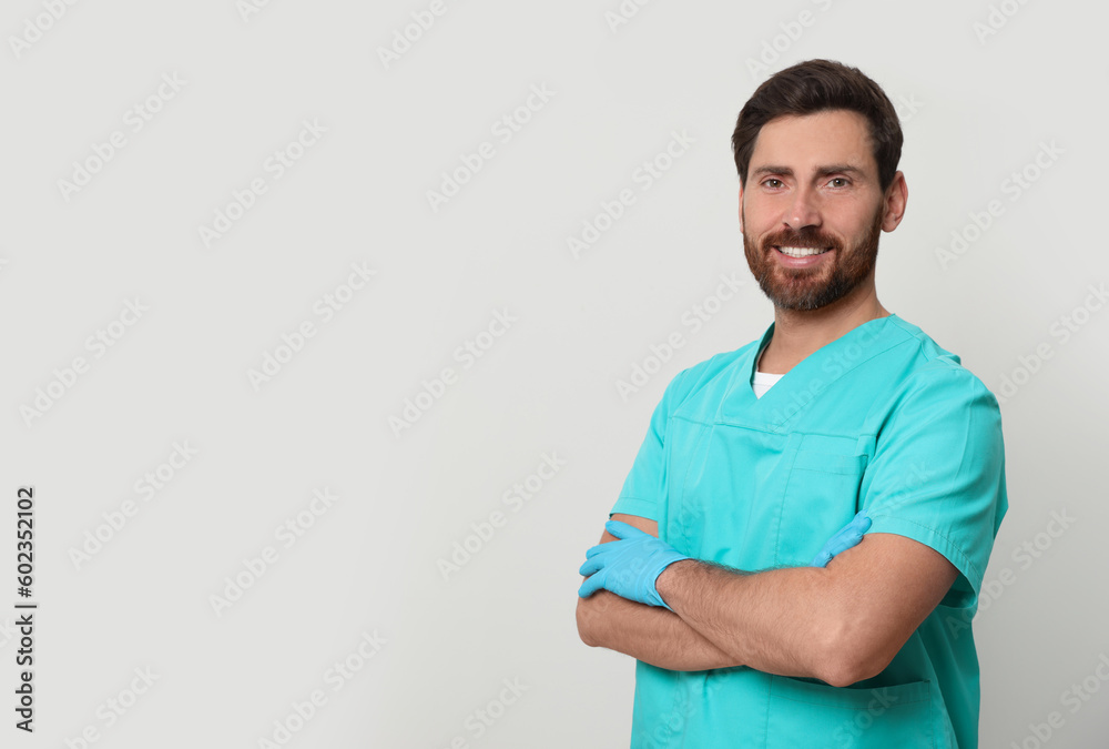Happy nurse in medical uniform on white background, space for text Happy nurse in medical uniform on white background, space for text
