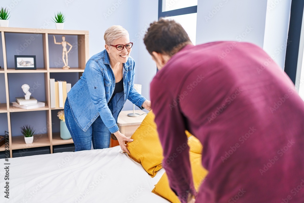 Mother and son smiling confident make bed at bedroom Mother and son smiling confident make bed at bedroom