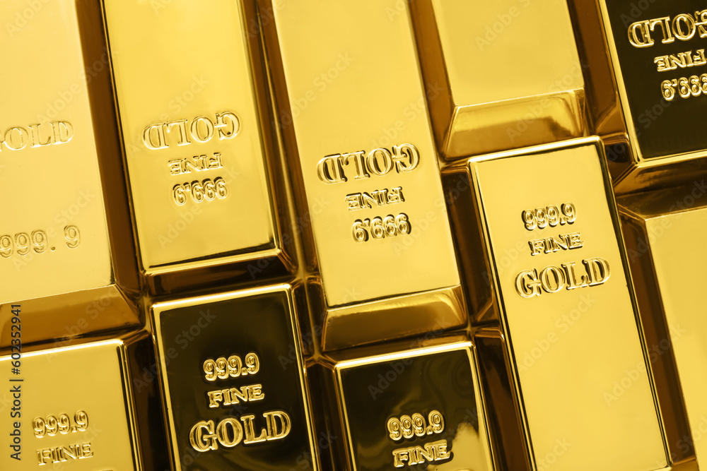 Many shiny gold bars as background, top view Many shiny gold bars as background, top view