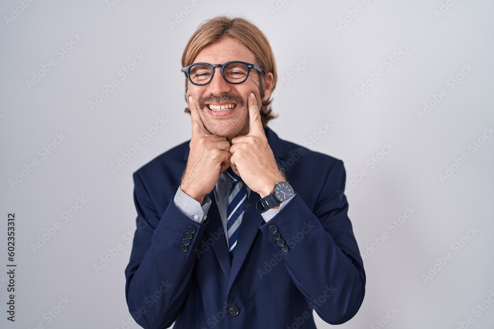 Caucasian man with mustache wearing business clothes smiling with open mouth, fingers pointing and forcing cheerful smile Caucasian man with mustache wearing business clothes smiling with open mouth, fingers pointing and forcing cheerful smile