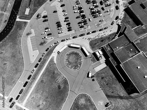 Drone overhead aerial view of a school letting out students at the end of the day.