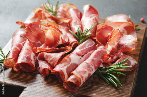 Cured Meat Platter, Coppa with Spices, Italian Antipasto, Appetizer over Dark Background