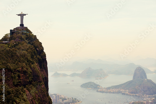 Mountain, monument and aerial of Christ the Redeemer on hill for tourism, sightseeing and travel destination. Traveling mockup, Rio de Janeiro and statue, sculpture and city landmark by Brazil ocean