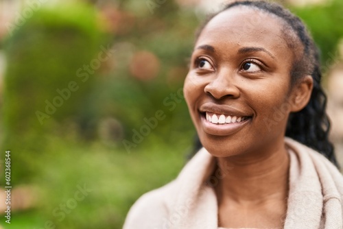 African american woman smiling confident standing at park