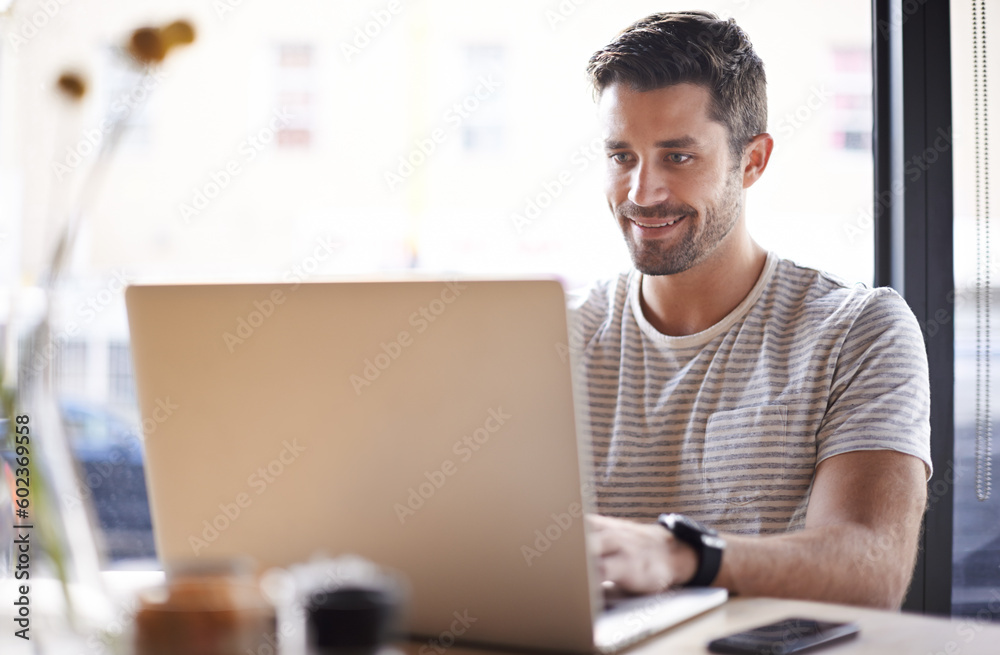 Employee, typing and man with a laptop, cafe and research for a new project, information and review. Male entrepreneur, happy guy or freelancer with technology, pc and search website in a coffee shop