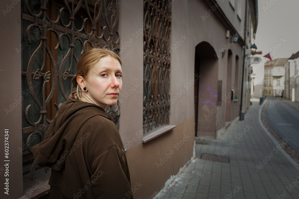 Portrait of a beautiful blonde girl in the city