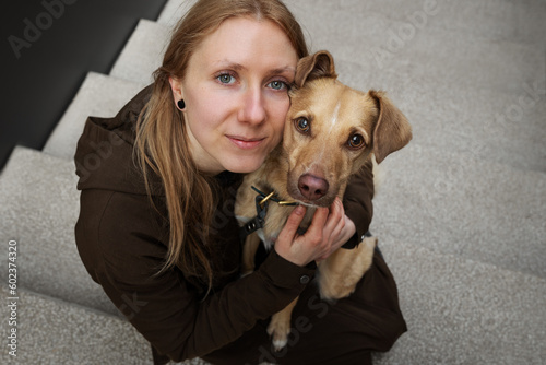 Obraz na płótnie Portrait of beautiful blonde girl with a dog w salonie