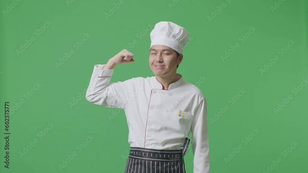 Asian Man Chef Smiling And Flexing His Bicep While Standing In The Green Screen Background Studio
Asian Man Chef Smiling And Flexing His Bicep While Standing In The Green Screen Background Studio