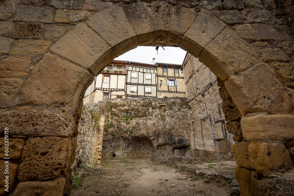 medieval arch with a view to the hanging houses at Frías town, Las Merindades, province of Burgos, Castile and León, Spain