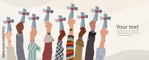 Tableau sur toile Group of people hands raised holding a crucifix