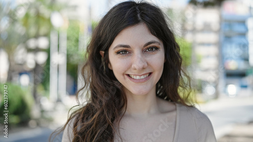 Young beautiful hispanic woman smiling confident standing at park Free Download Young beautiful hispanic woman smiling confident standing at park - GFXLoad